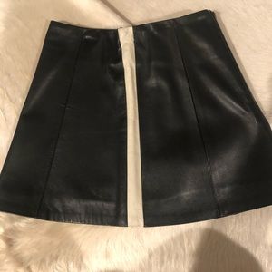Mini leather skirt with stripes on side